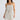 Front close-up view of the Elsbeth Top in Ivory Spot featuring a square neckline, thin shoulder straps, and a waist tie.