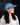 Embroidered Denim Cap featuring mid-wash cotton denim with embroidered cherries and an adjustable strap in a lifestyle view.