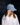 Embroidered Denim Cap featuring mid-wash cotton denim with embroidered red hearts and an adjustable strap in a lifestyle view.