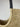 Faly Bag close up of the woven raffia texture and dark leather wrapped handle.