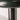 Detailed close-up focusing on the seamless connection between the iron shade and cylindrical stem.