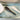 Handcrafted ceramic serving spoon in charcoal, small 10cm size, dishwasher and microwave safe, minimalist kitchenware.