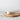 Handcrafted ceramic sugar pot in white, 7cm high by 6cm wide, on a round wooden board with a spoon and towel.