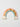 Fun House Tile Kids playful capiz wall art piece in the Rainbow style featuring a colourful rainbow arch and text shown in a studio view.