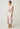 Side view of the Geneva twist detail midi dress in Nautilus Bloom print highlighting the side splits and column silhouette.