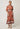 Front studio view of the Gisela linen column midi dress in amber vine with soft bubble sleeves and a column silhouette.