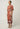 Side view of the Gisela linen column midi dress in amber vine showing side splits for ease of movement.