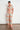 Glare Top Spring Glow shown in a full length styled view highlighting the relaxed fit and button-through front.