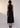 Hali Dress Black back view featuring a fixed halter style neckline with a two-button fastening and sleeveless design.