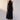 Hali Dress Black front view featuring a crossover halter neckline, tie belt, and 100% cotton maxi length silhouette.
