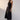 Hali Dress Black side view featuring a relaxed fit through the body and topstitch detailing throughout.