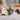 Hanging Angel in green crafted from ceramic with natural twine shown in a close up view.