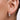 Model wearing the silver Holly mini double row bauble hoop earring on the earlobe.