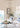 Hardback front cover of Home Beautiful - Coastal Homes, featuring bright beachside interior design photography with classic blue and white accents.