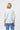 Back view of the Isabella Shirt in Powder Blue showing the ruffled collar and embroidered elbow-length sleeves.