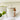 Ivory jar with spoon featuring a silicon seal and a wooden spoon shown in a clean front view.