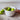 Ivory pouring bowl perfect for mixing and pouring ingredients for pancakes or cakes shown styled with green apples.