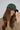 Kenny Cap in olive cotton fabric worn by a model.