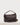 Large Bolster Bag in rich mahogany waxy leather featuring a spacious cylindrical silhouette, short fixed carry handle, and adjustable crossbody strap.