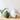 Large Hanging Metal Bells displayed on a wooden shelf showcasing their oversized design and classic holiday character.