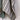 Linen Stripe Teatowel in natural and forest green draped over a rail showcasing its soft natural texture.