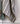 Linen Stripe Teatowel in natural and forest green draped over a rail showcasing its soft natural texture.