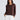Lorrie Frill Cardigan close-up view highlighting the round neckline, button-through front placket with delicate frills, and long sleeves with frilled cuffs.