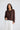 Lorrie Frill Cardigan in chocolate front view, featuring a regular fit cotton fine knit with button-through front and frill placket details paired with white pants.
