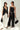 Two women wearing black and white outfits with sunglasses and handbags on a white background