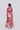 Louna maxi dress back view featuring a silk linen blend maxi classic shirt dress with long sleeves and a self tie rope belt in pink red floral.