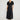 Lucienne Dress Black featuring a V-neckline and A-line silhouette in textured satin.