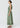 Lume Dress Gingham slip on style 100% linen dress featuring a round neckline, sleeveless design, and elasticised waistband shown in a side view.