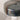 Close-up view of the darkened iron shade with a polished finish and top knob detail.