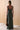Back view of the Marla dress in evergreen showcasing a maxi-length silhouette and fully lined 100% rayon interior.