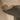 Detailed close-up of the handcrafted moody dark ceramic surface and sweeping edge.