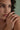 Lifestyle close-up view of a model wearing the sterling silver Maya Ring featuring a trio of bezel-set marquise cubic zirconia stones.