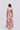Melinda maxi shirt dress back view featuring a silk linen blend maxi classic shirt dress with long sleeves and a self tie rope belt in pink green floral.