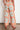 Merchant Pant Spring Glow shown from the back featuring a straight-leg silhouette, cropped length, and vibrant spring glow print in a lyocell-linen blend.