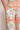 Merchant Pant Spring Glow showing a close-up of the functional side seam pockets and smooth lyocell-linen fabric.