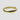 Gold ring with a wavy design on a white background