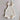 Mila Pointelle Tie Romper Snow knitted in a signature pointelle design featuring adjustable tie shoulders and leg frills shown in a flat lay front view.