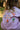 Back view of the lilac reversible cotton kids t-shirt with colourful hand-drawn graphic print.