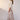 Nixie Skirt Toffee Gingham side view featuring a maxi length and a two-tiered swing silhouette in soft toffee gingham.