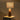 Illuminated view of the Olive Resin lamp with sage shade table lamp casting a warm glow through the sage shade.