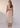 Ozzy Denim Dress Butter Denim back view featuring an elasticised waist and midi-maxi length silhouette in butter denim.