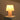 Illuminated view of the Pink Resin Base and Shade table lamp showcasing a warm glow through the translucent resin.