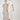 Poem Dress Painterly Bloom crafted in a lyocell linen blend featuring scattered florals, short tulip sleeves, and lace inserts shown in a front view.