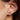 Poni stud horseshoe earrings worn by a model to showcase size and fit.