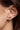 Poni stud horseshoe earrings worn by a model to showcase size and fit.