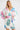 Porto Dress Perfect French true wrap style short dress featuring a V-shaped neckline and waist tie detail shown in a close up view.